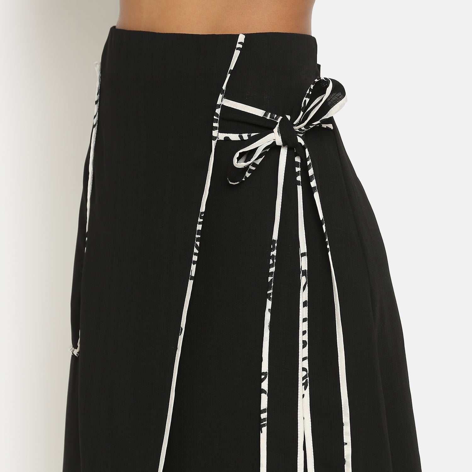 Black Asymmetrical Skirt With Contrast Piping, frocks for women
indian designer skirts?