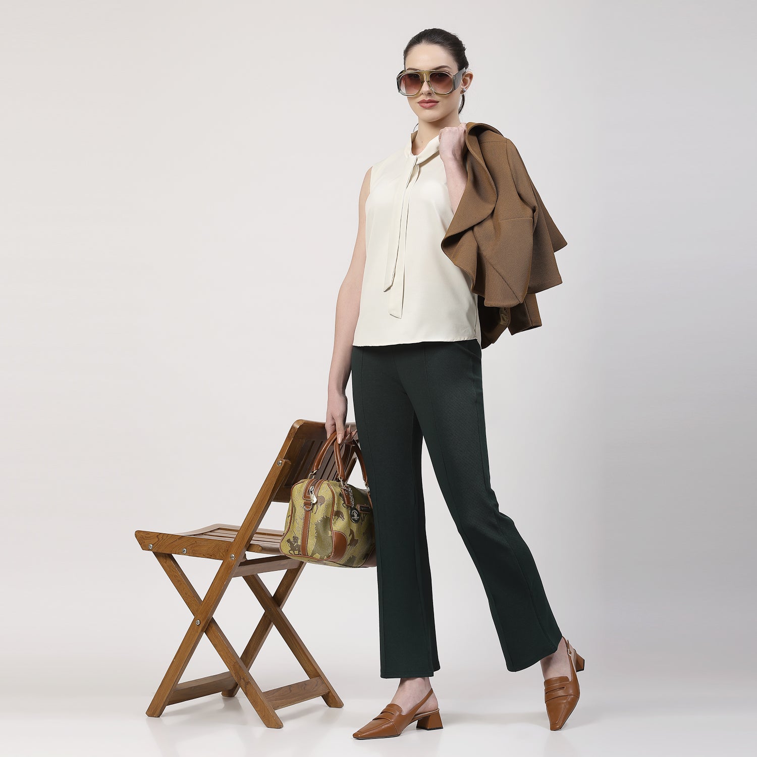 Cream Sleeveless Top With Tie Knot